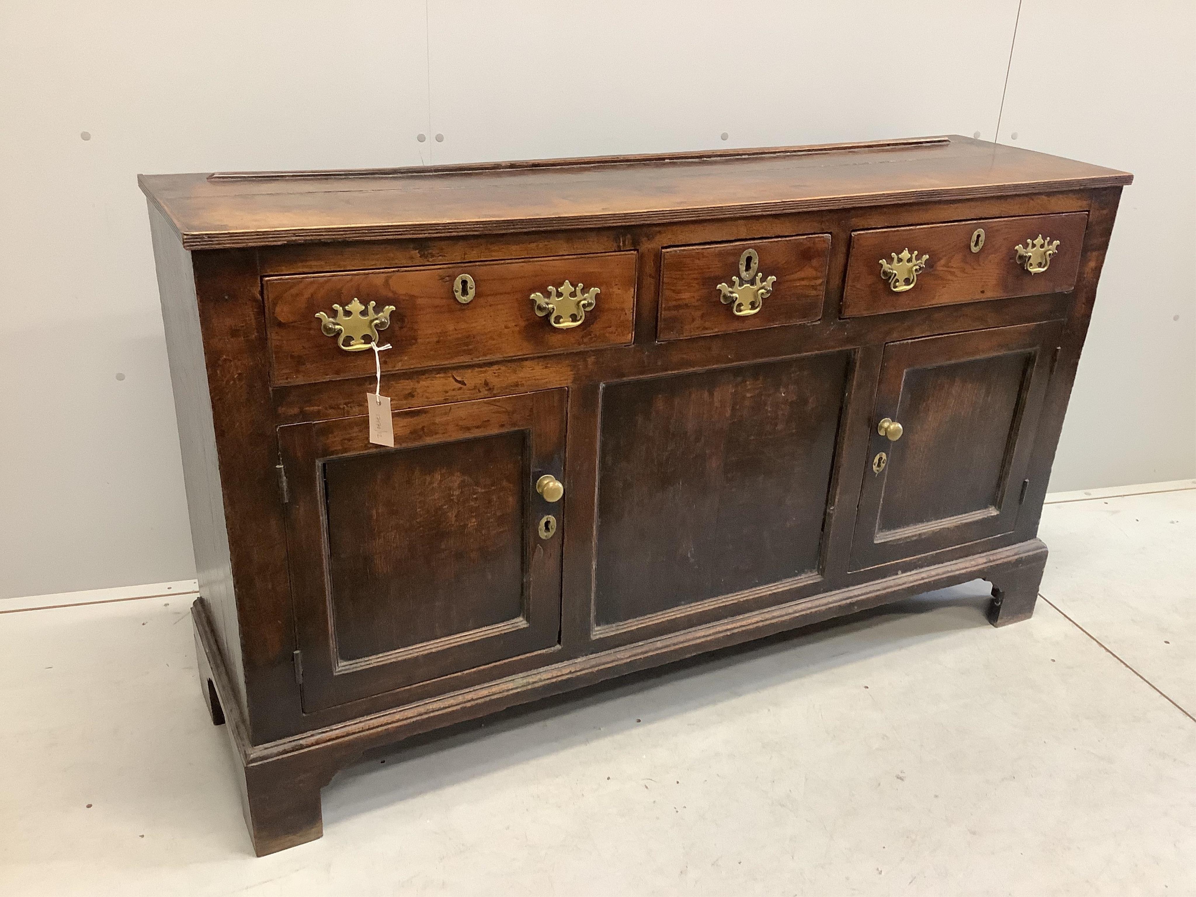 An 18th century oak low dresser, width 154cm, depth 42cm, height 90cm. Condition - fair